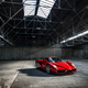 Illustration for article titled Watch This Black Ferrari Enzo Do Gratuitous Donuts In A Warehouse